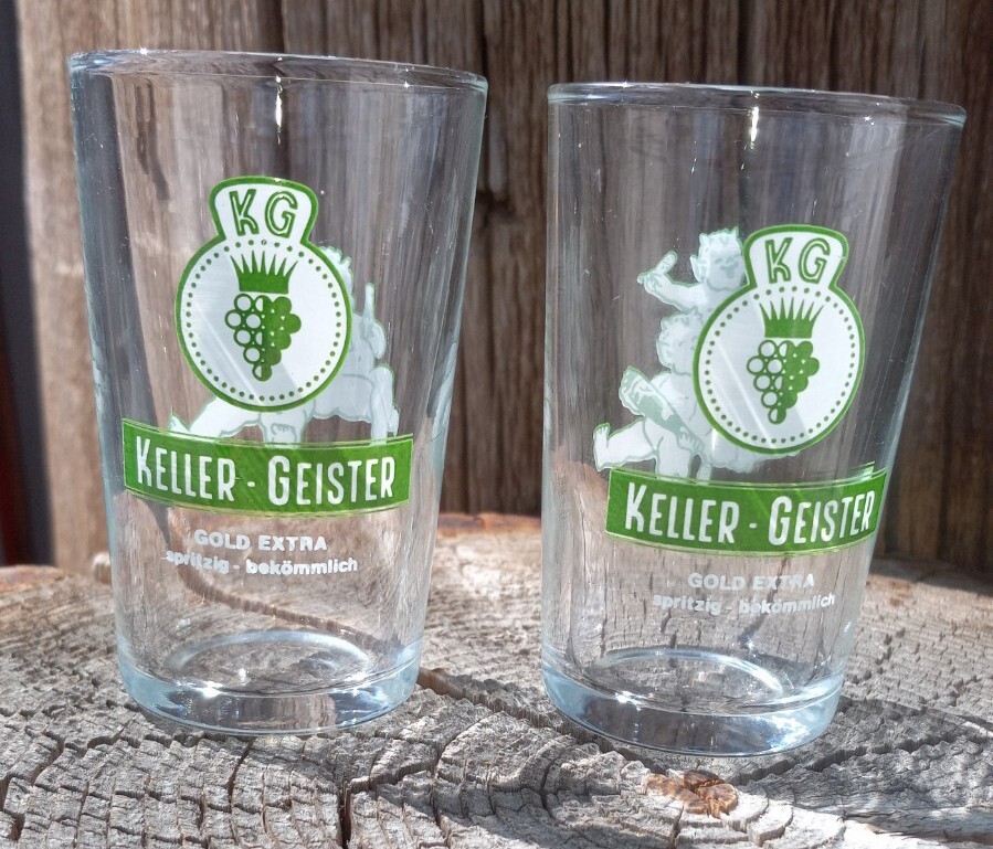 Vintage pair of Keller Geister Gold Extra Secco Wine Tasting Glasses Devil Baby