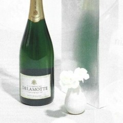 Delamotte Champagne Print Ad, Green Bottle White Background White Flower Vase