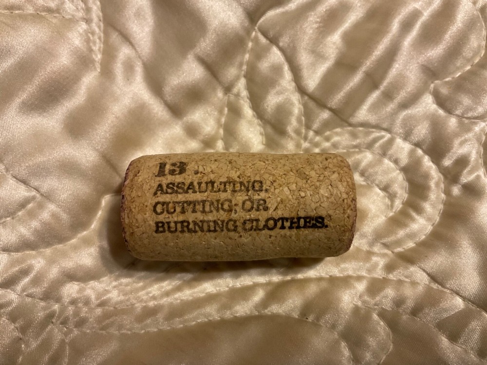 19 Crimes Collectible Wine Cork #13 Assaulting Cutting or Burning Clothes Cork