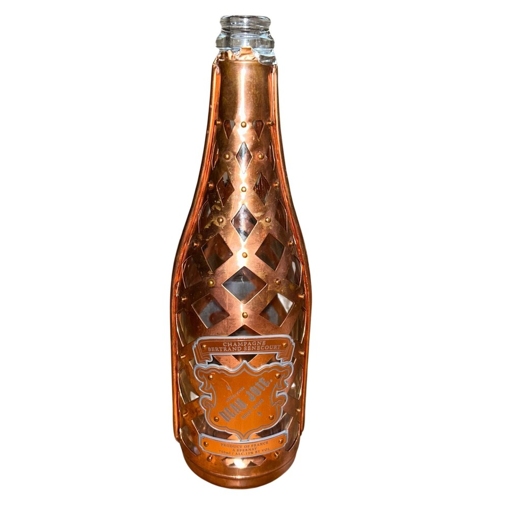 Empty Beau Joie Special Cuvee Brut Rosé Champagne bottle