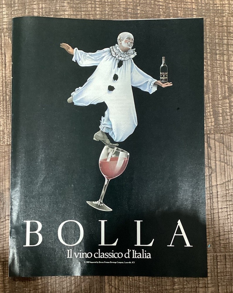 1989 Bolla Wine – Italian Clown Balancing On Glass Holds Bottle – Print Ad Photo